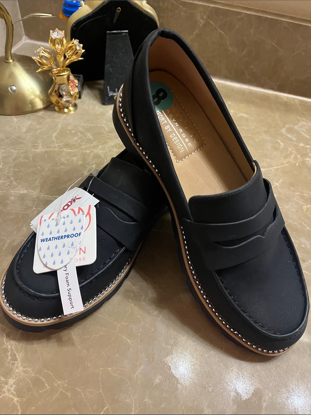 Womenโs black loafers